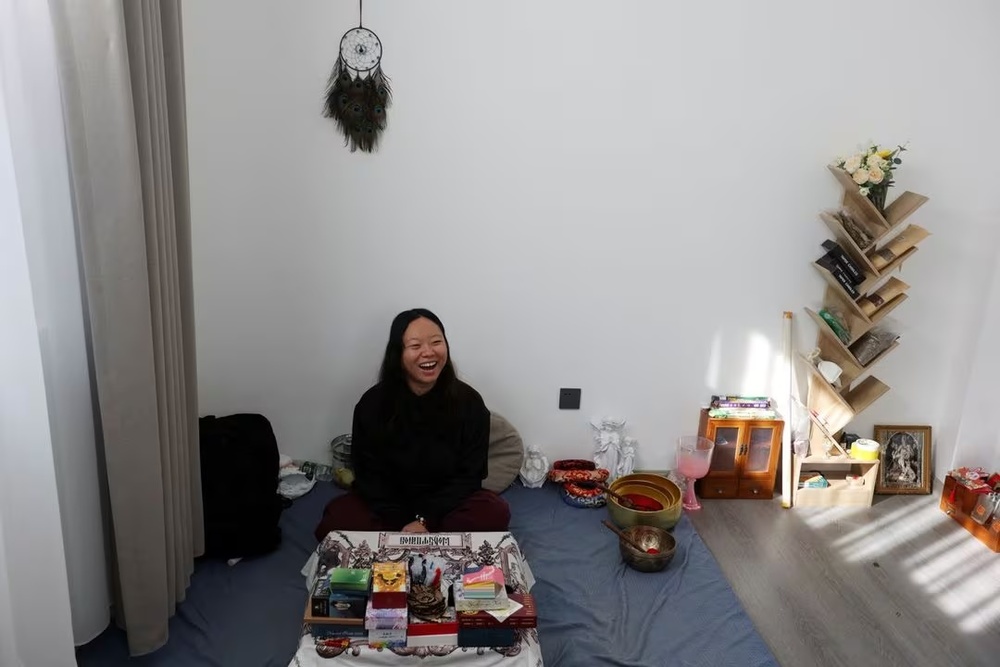 Bai Yunxi, 33, a full-time astrologer, laughs during an interview with Reuters in Dali, Yunnan province, China November 10, 2023. REUTERS/Florence Lo/File Photo Bai Yunxi, 33, a full-time astrologer, laughs during an interview with Reuters in Dali, Yunnan province, China November 10, 2023. REUTERS/Florence Lo/File Photo