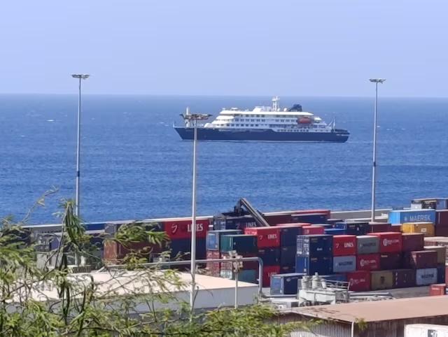 Cruise ship MV Hondius docks off Cape Verde port, as passengers were not allowed off the ship, while health authorities investigated suspected cases of hantavirus aboard the vessel, in Praia Port, Cape Verde, May 4, 2026. Picture taken with a mobile phone. REUTERS/Stringer