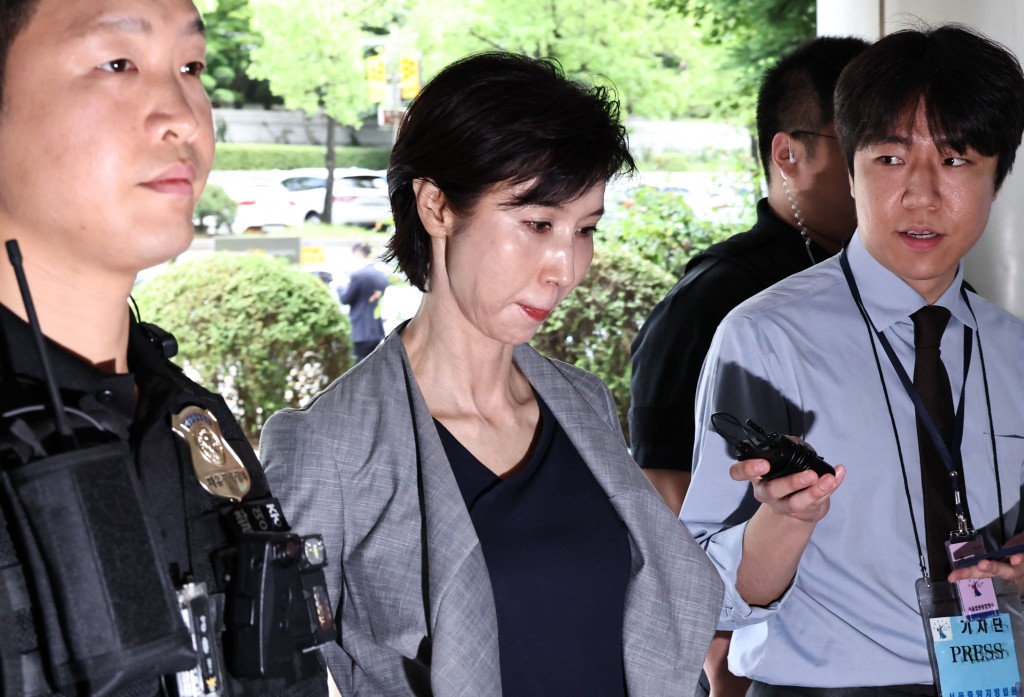 This picture taken on June 26, 2026 shows Roh Soh-yeong, director of Art Center Nabi, arriving at a court to attend her retrial regarding the division of assets with her former husband SK Group Chairman Chey Tae-won at the Seoul High Court in Seoul. (Photo by YONHAP / AFP)