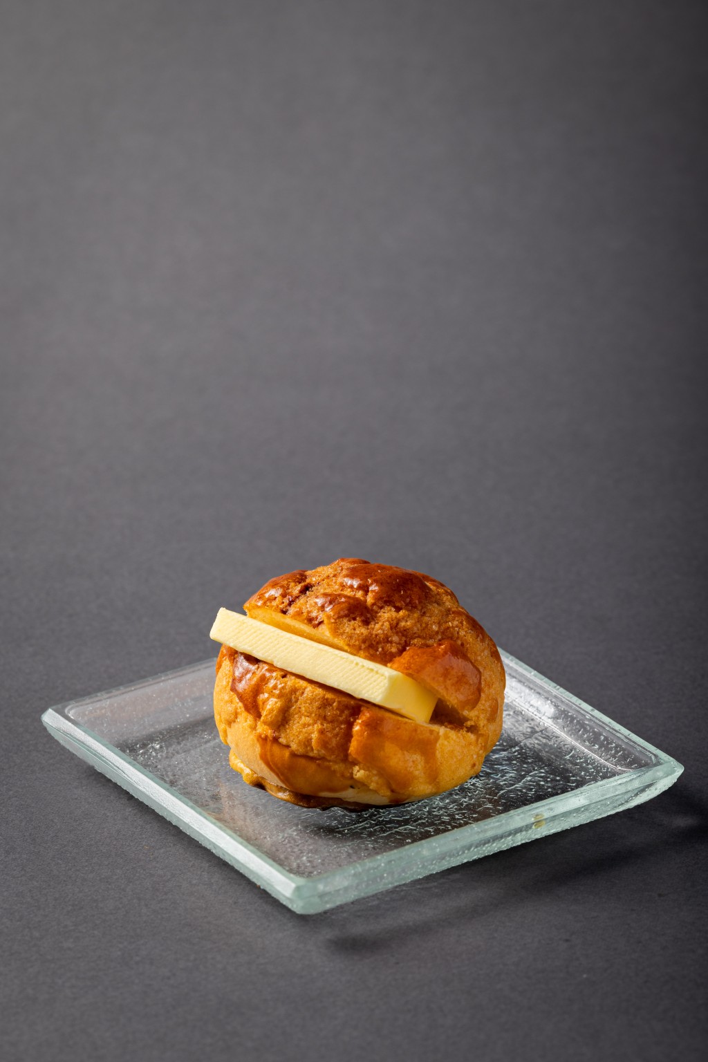 Mini Classic Pineapple Bun with Butter (Maxim’s Cakes, festival exclusive) - the cha chaan teng staple returns in miniature form, pairing a crisp-topped, fluffy pineapple bun with a thick slice of butter for a simple taste of Hong Kong nostalgia.