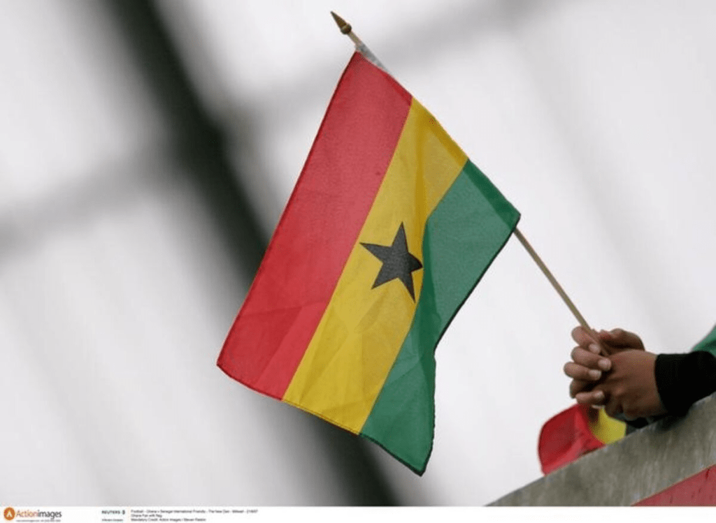 A person holding a Ghana flag in a file photo. Fan with flag Mandatory Credit: Action Images / Steven Paston