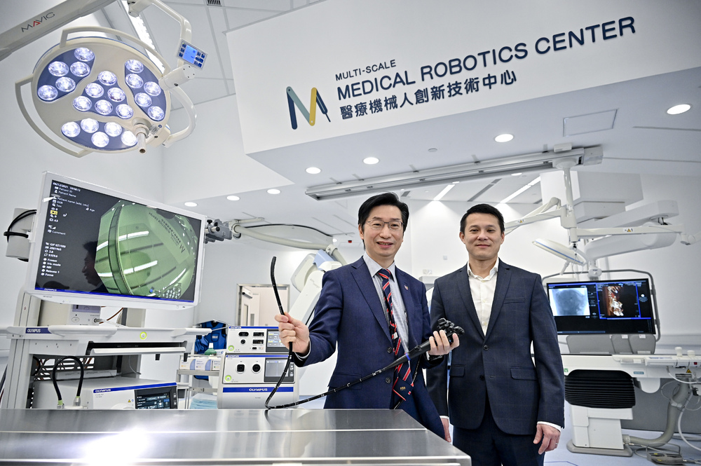From left: Philip Chiu and Samuel Au, and the robotic arm with a 3D camera. From left: Philip Chiu and Samuel Au, and the robotic arm with a 3D camera.