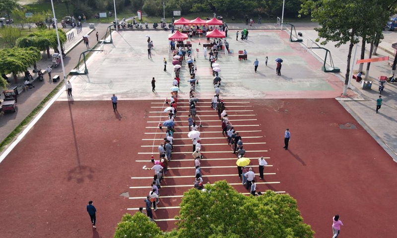 Residents line up for swab samples for nucleic acid testing at a community in Lu'an, in eastern China's Anhui province, May 22, 2021. Lu'an began a second round of coronavirus disease tests on May 17. Residents line up for swab samples for nucleic acid testing at a community in Lu'an, in eastern China's Anhui province, May 22, 2021. Lu'an began a second round of coronavirus disease tests on May 17.