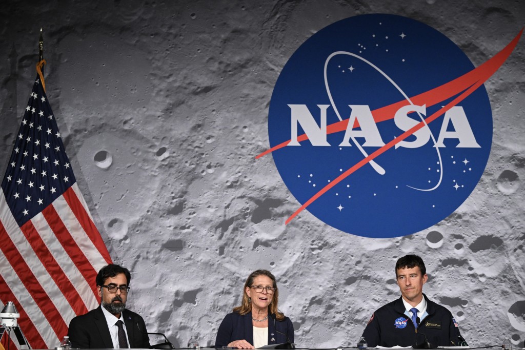 Photo by RONALDO SCHEMIDT / AFP. Lori Glaze (C), acting associate administrator for NASA’s Exploration Systems Development Mission Directorate, speaks next to NASA's associate administrator Amit Kshatriya (L) and NASA flight director Rick Henfling (R), during a press conference at Johnson Space Center in Houston, Texas, on April 10, 2026, after the Artemis II astronauts splashed down in the Pacific Ocean off the coast of California.