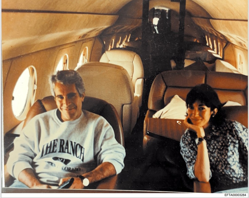 Photo by HANDOUT / US DEPARTMENT OF JUSTICE / AFP  This undated photo provided by the US Justice Department on December 19, 2025 shows Jeffrey Epstein, a wealthy US financier who died in jail in 2019 while awaiting trial for sex trafficking underage girls, and his associate, Ghislaine Maxwell aboard a jet.