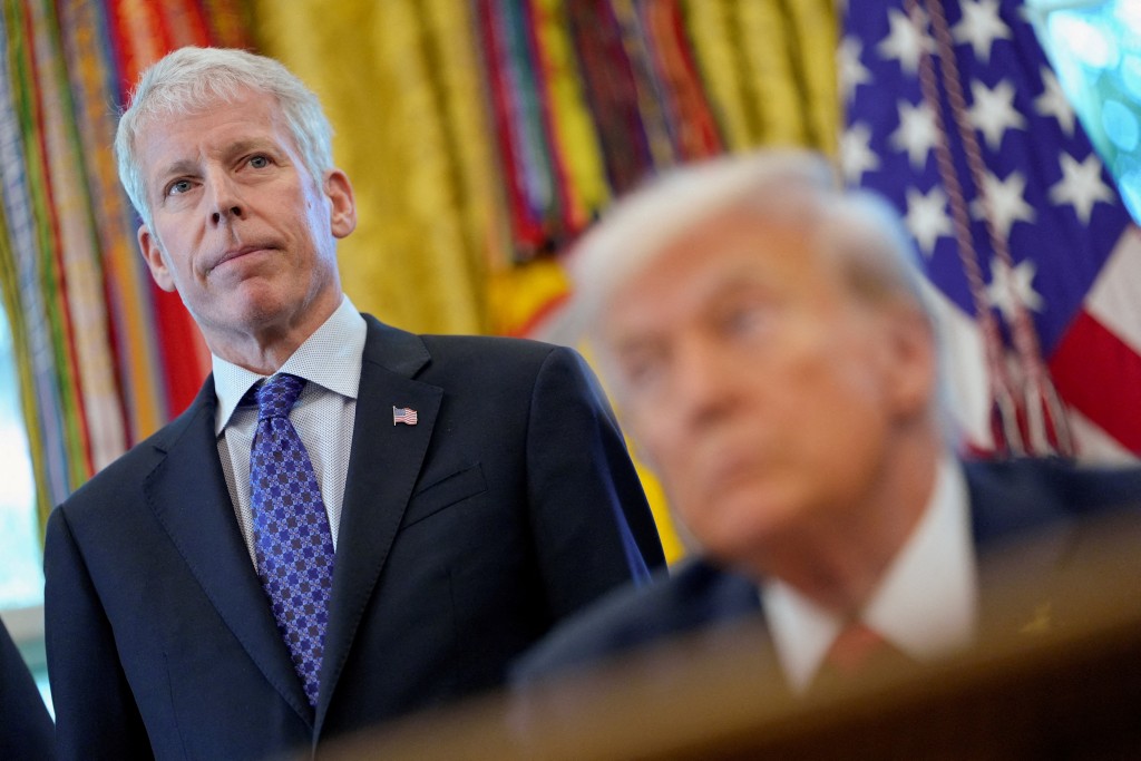 U.S. Department of Energy Secretary Chris Wright and U.S. President Donald Trump look on during an event at the White House, in Washington, D.C., U.S., October 6, 2025. REUTERS
