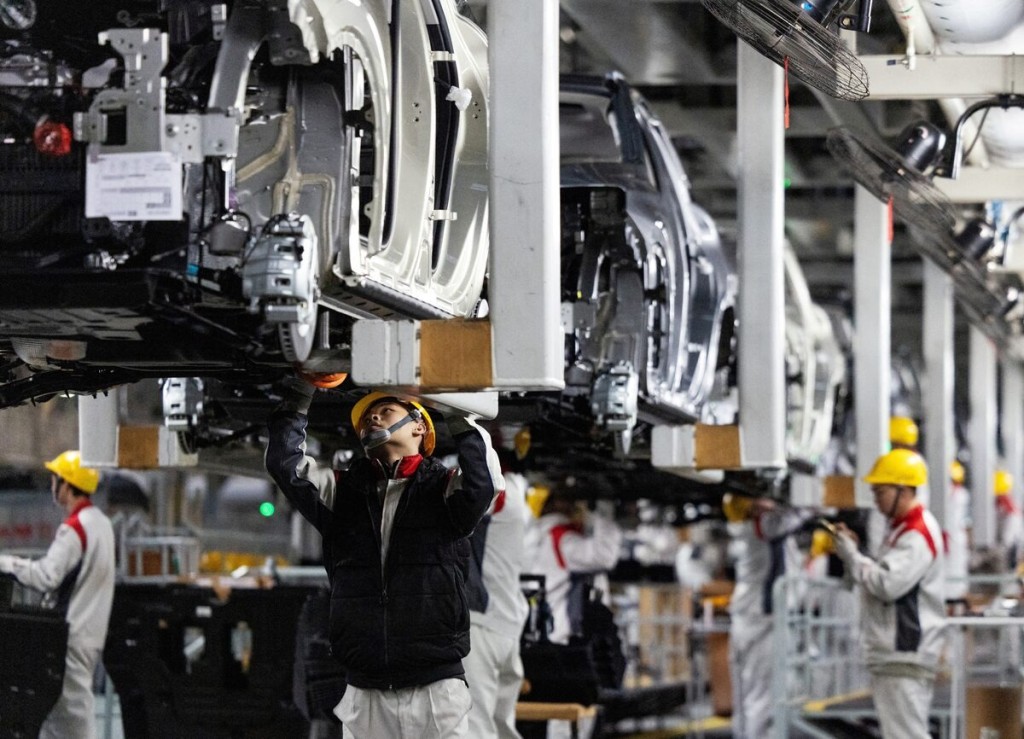Employees work at the car production line during organized media tour at the Chinese automaker GWM (Great Wall Motor) plant in Baoding, Hebei province, China, November 24, 2025. REUTERS