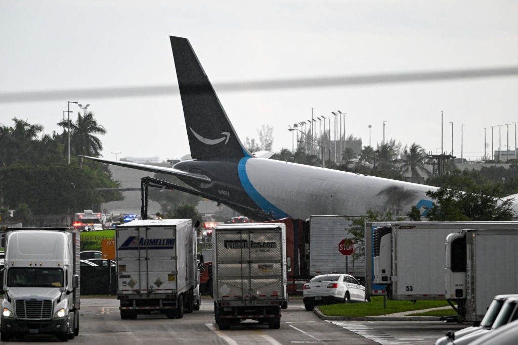 The tail section of a cargo plane is seen at Miami International Airport after it overran the runway at Miami International Airport in Miami, Florida, on September 6, 2026. (AFP) The tail section of a cargo plane is seen at Miami International Airport after it overran the runway at Miami International Airport in Miami, Florida, on September 6, 2026. (AFP)