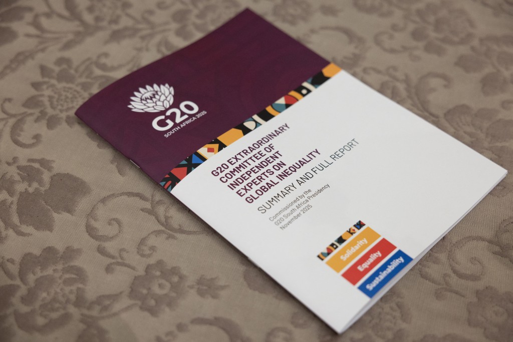 A general view of the G20 Inequality Committee's Report on global inequalities after it was handed over to South Africa's President Cyril Ramaphosa by US economist and recipient of the Nobel Prize in Economic Sciences Joseph Stiglitz, at Tuynhuys in Cape Town on November 4, 2025. (Photo by GIANLUIGI GUERCIA / AFP)