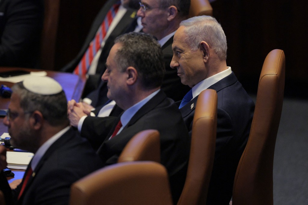 Photo by CHIP SOMODEVILLA / POOL / AFP. Israeli Prime Minister Benjamin Netanyahu listens to the US president's address at the Israeli parliament, the Knesset, in Jerusalem on October 13, 2025.