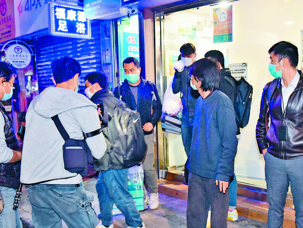 Police search the church in Fan Ling as Lau Ka-tung, below right, is taken away for questioning. SING TAO Police search the church in Fan Ling as Lau Ka-tung, below right, is taken away for questioning. SING TAO
