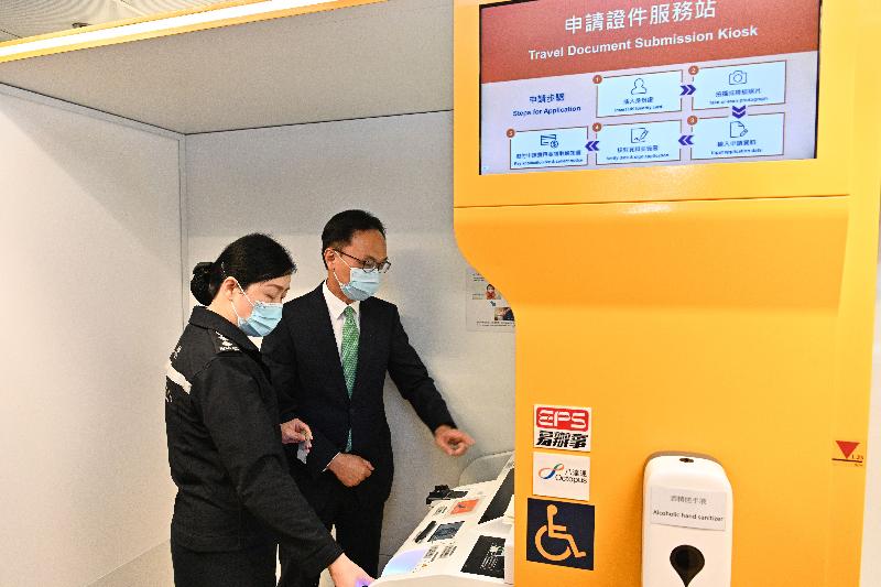 The Secretary for the Civil Service, Patrick Nip, is briefed about applying for Hong Kong Special Administrative Region passports using the travel document submission kiosk. The Secretary for the Civil Service, Patrick Nip, is briefed about applying for Hong Kong Special Administrative Region passports using the travel document submission kiosk.