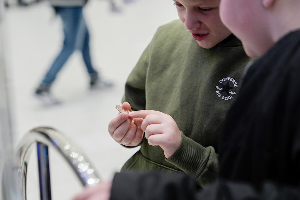 Brentley Joyce, 8, and Hunter Kimbel, 7, look at a souvenir penny from a penny press machine at the American Dream mall, Sunday, March 2, 2025, in East Rutherford, N.J. (AP Photo/Julia Demaree Nikhinson) ASSOCIATED PRESS Brentley Joyce, 8, and Hunter Kimbel, 7, look at a souvenir penny from a penny press machine at the American Dream mall, Sunday, March 2, 2025, in East Rutherford, N.J. (AP Photo/Julia Demaree Nikhinson) ASSOCIATED PRESS