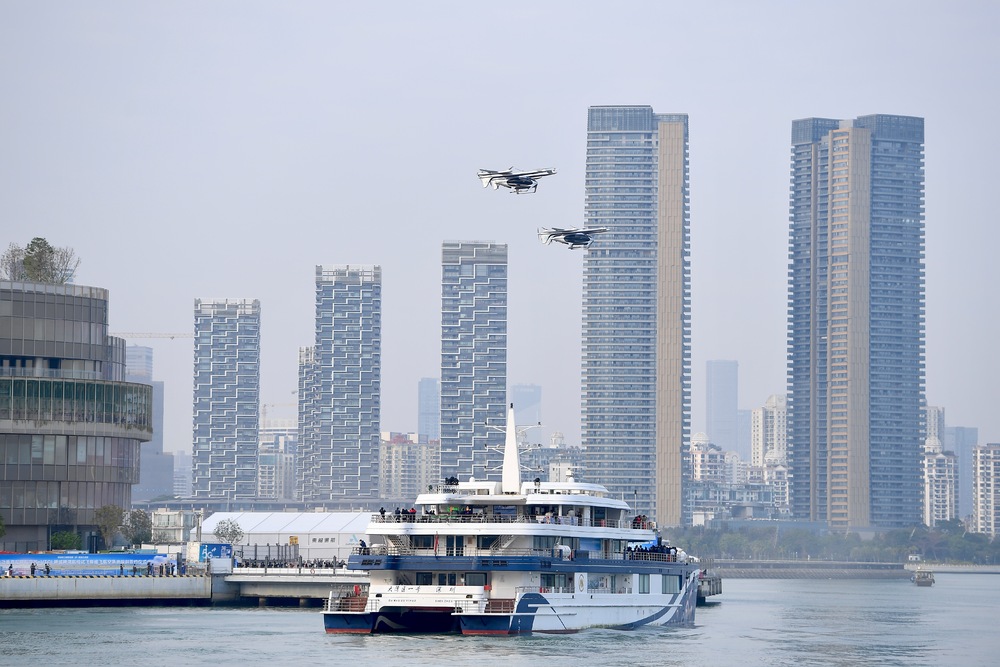 An electric vertical take-off and landing drone taxi in Shenzhen before, below, taking off for Zhuhai. An electric vertical take-off and landing drone taxi in Shenzhen before, below, taking off for Zhuhai.