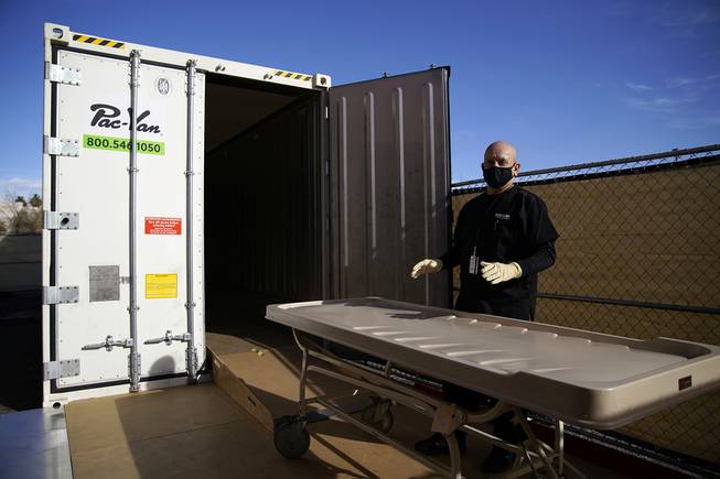 Michael Murphy, a consultant serving as interim Clark County coroner, gives a tour of a refrigerated trailer at the coroner’s office Friday, January 8, 2021, in Las Vegas. The trailer is currently unused but is in place in case of a surge in coronavirus deaths. Michael Murphy, a consultant serving as interim Clark County coroner, gives a tour of a refrigerated trailer at the coroner’s office Friday, January 8, 2021, in Las Vegas. The trailer is currently unused but is in place in case of a surge in coronavirus deaths.