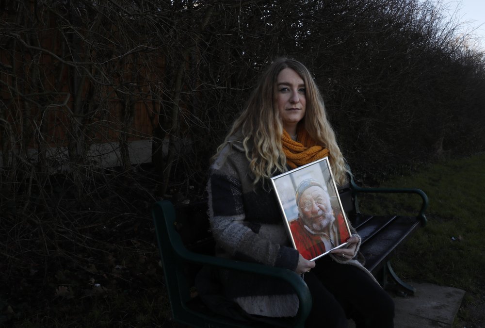 Jo Goodman holds a portrait of her late father Stuart in London, Friday, January 22, 2021. Jo's father Stuart died in April 2020. A couple of months after her father died, Goodman, 32, co-founded the COVID-19 Bereaved Families for Justice group to pressure the government to back a public inquiry into how the pandemic was handled. Jo Goodman holds a portrait of her late father Stuart in London, Friday, January 22, 2021. Jo's father Stuart died in April 2020. A couple of months after her father died, Goodman, 32, co-founded the COVID-19 Bereaved Families for Justice group to pressure the government to back a public inquiry into how the pandemic was handled.