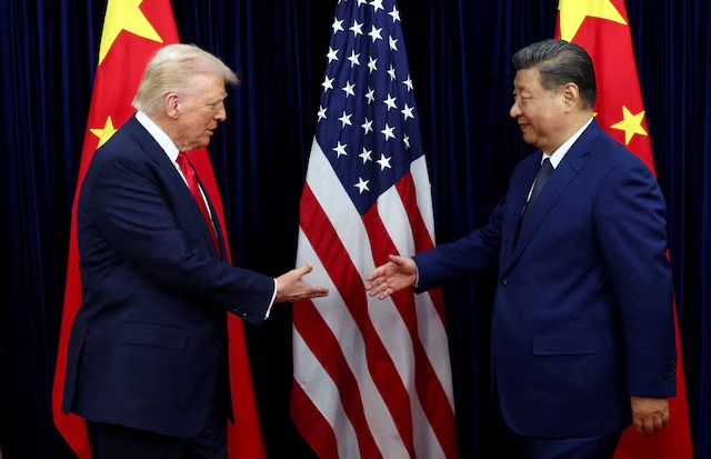 U.S. President Donald Trump shakes hands with Chinese President Xi Jinping as they hold a bilateral meeting at Gimhae International Airport, on the sidelines of the Asia-Pacific Economic Cooperation (APEC) summit, in Busan, South Korea, October 30, 2025. REUTERS/Evelyn Hockstein/File Photo