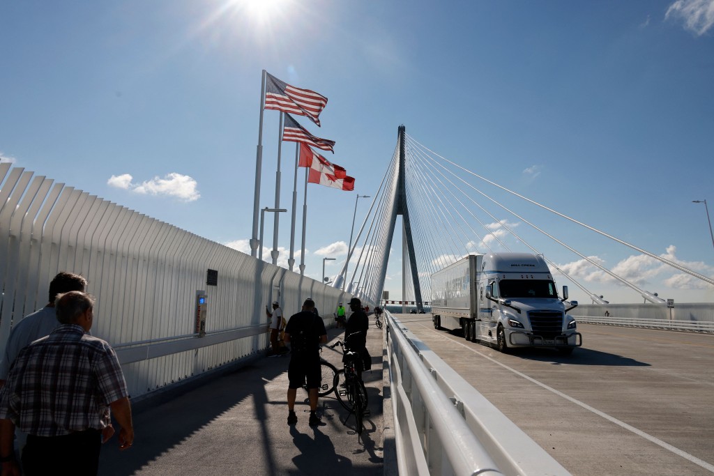 Trucks cross in to the United States on the Gordie Howe International bridge that connects Windsor, Ontario,  Canada and Detroit, Michigan on September 6, 2026. AFP