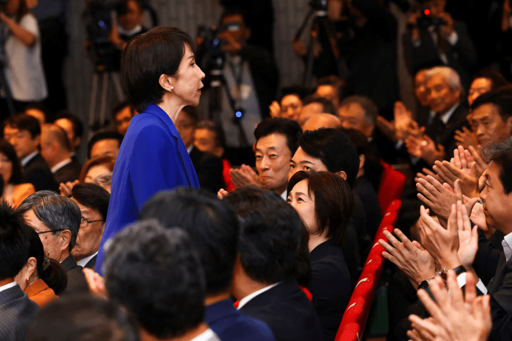 Newly-elected Liberal Democratic Party (LDP) leader Sanae Takaichi reacts as she receives an applause from gathered lawmakers on the day of the LDP leadership election in Tokyo, Japan, October 4, 2025. REUTERS/Kim Kyung-Hoon/Pool