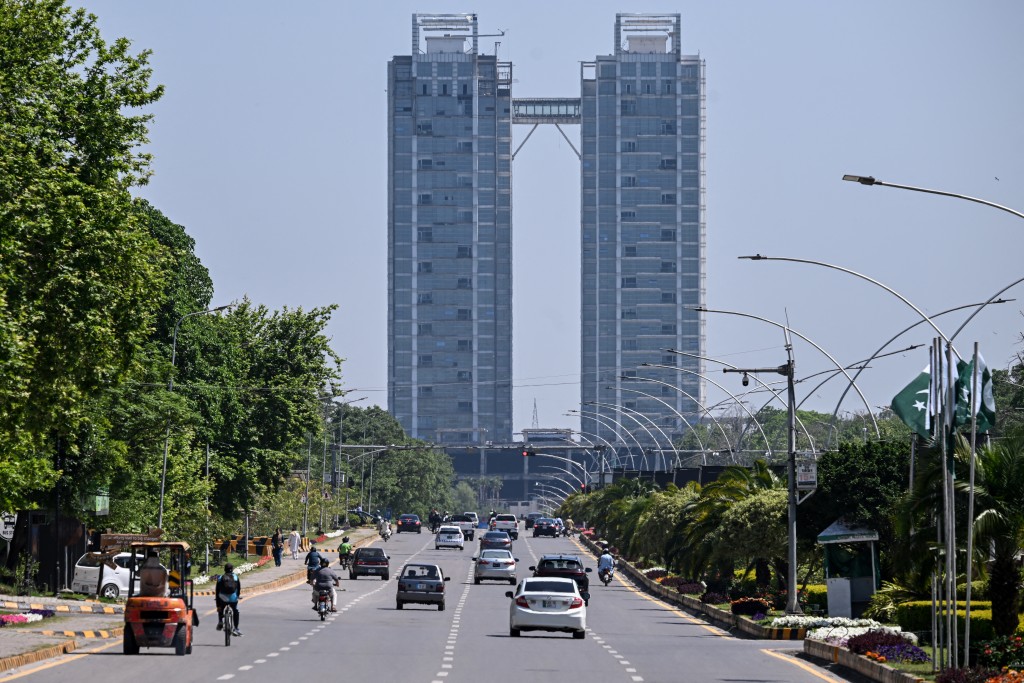 Photo by FAROOQ NAEEM / AFP Motorists ride along a road on Islamabad’s Constitution Avenue on April 14, 2026.