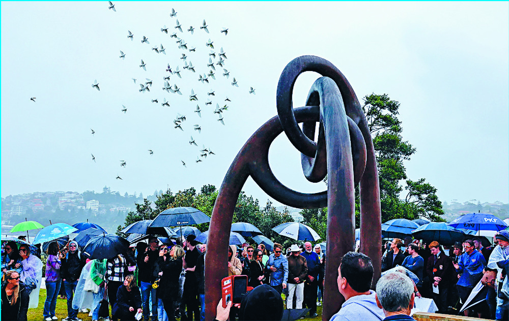 Doves are released during a commemoration ceremony at Coogee Beach in Sydney.  AFP