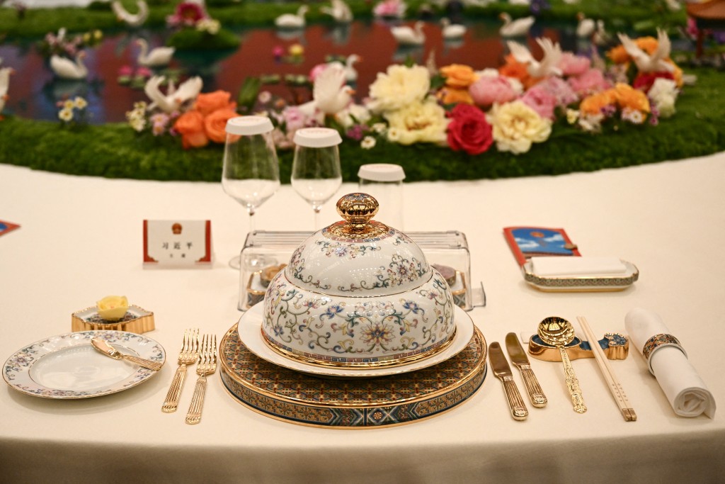 The table setting for China's President Xi Jinping is seen ahead of the state banquet for US President Donald Trump at the Great Hall of the People in Beijing on May 14, 2026. (AFP)