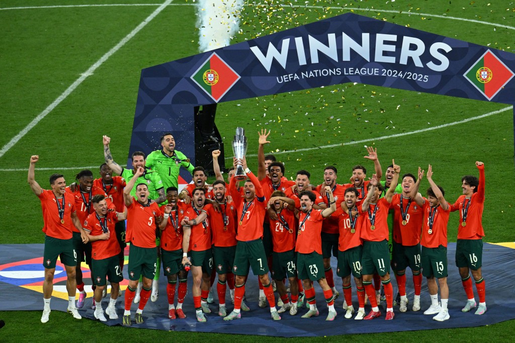Portugal's Cristiano Ronaldo lifts the trophy as he celebrates with teammates after winning the Nations League. (Reuters)