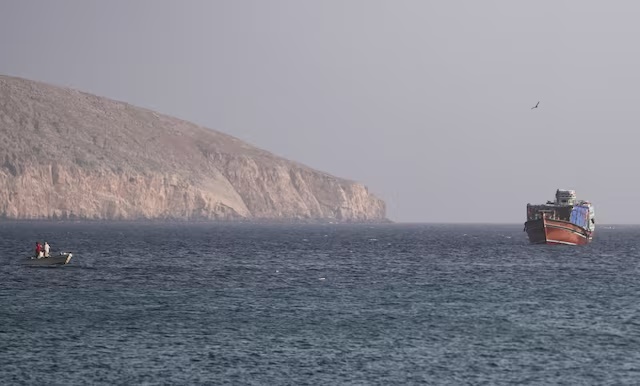 A vessel in the Strait of Hormuz, as seen from Musandam,Oman, July 16, 2026. REUTERS/Stringer