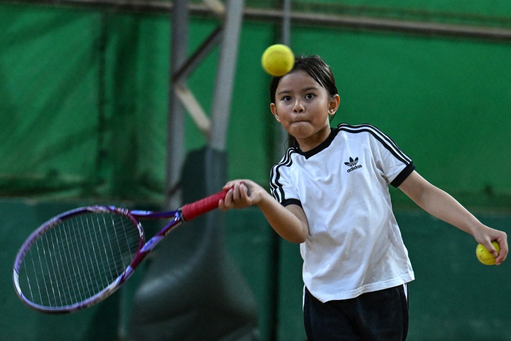 Photo by JAM STA ROSA / AFP  This photo taken on August 7, 2026, shows a child taking part in a training session at Alabang Tennis Academy in Muntinlupa, Metro Manila.