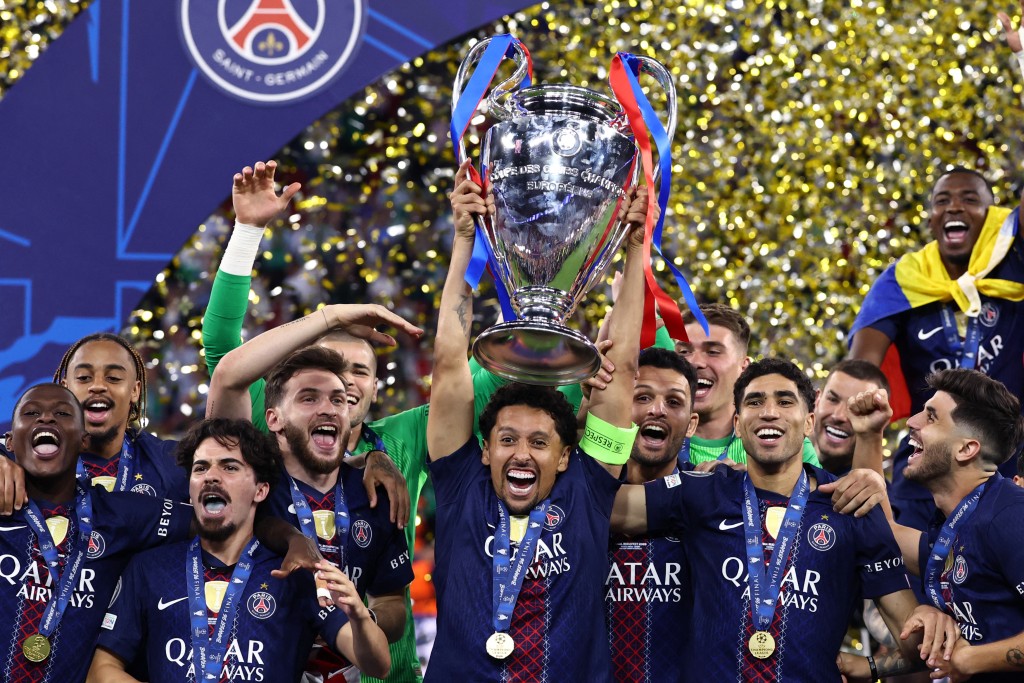 Paris Saint-Germain's Brazilian defender #05 Marquinhos lifts the trophy as he celebrates with teammates winning the UEFA Champions League final football match between Paris Saint-Germain (PSG) and Arsenal FC at the Puskas Arena in Budapest on May 30, 2026. (AFP)