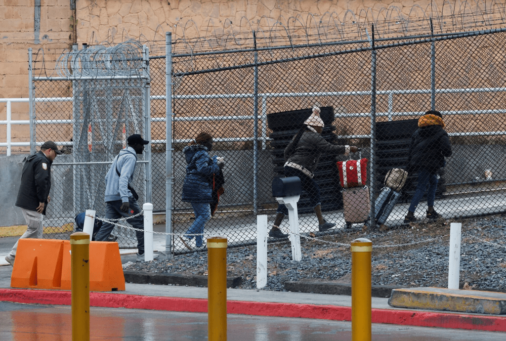 Asylum seekers arrive at the B and M Brownsville-Matamoros International Bridge, to attend their appointment with the U.S. Customs and Border Protection (CBP), on the day of the inauguration of U.S. President-elect Donald Trump, in Matamoros, Mexico January 20, 2025. REUTERS/Daniel Becerril