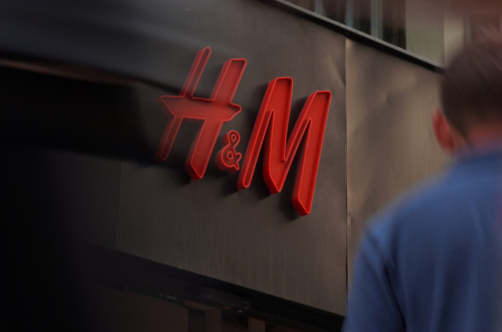 Pedestrians and shoppers walk past a branch of fashion retailer H&M in central Stockholm, Sweden, July 17, 2023. REUTERS