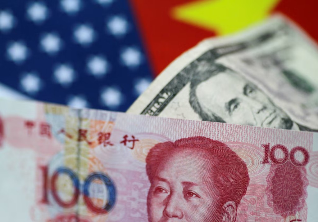 US Dollar and China Yuan notes are seen in this picture illustration. REUTERS