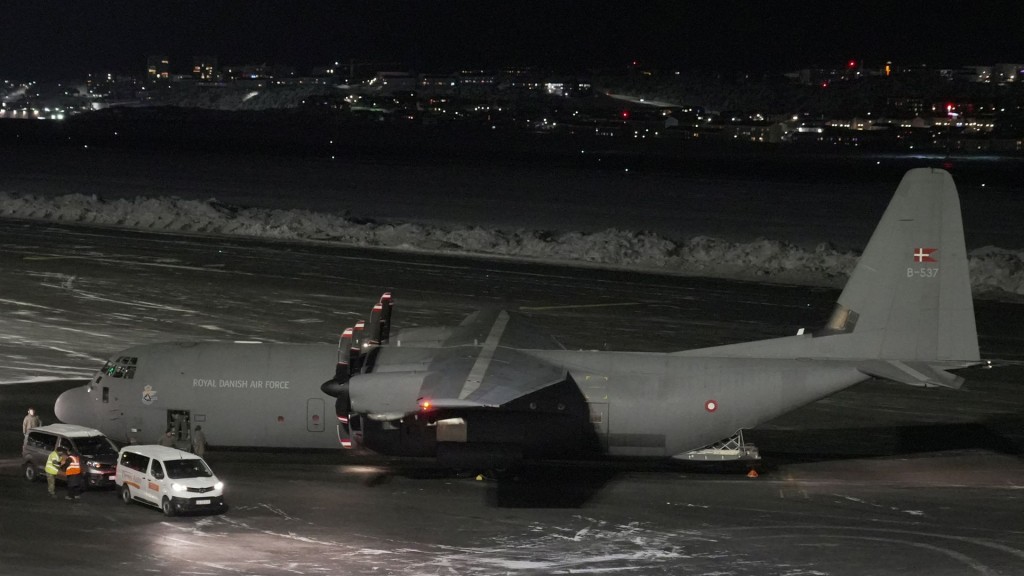 Royal Danish Air Force plane carrying personnel arrives in Greenland. Reuters