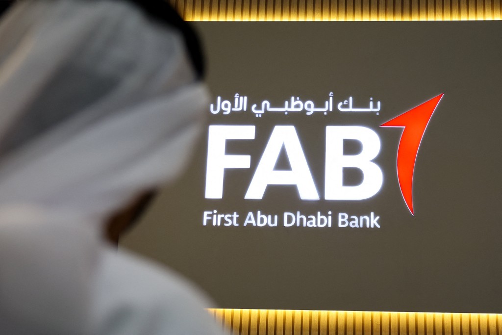 A logo of First Abu Dhabi Bank (FAB) is displayed at the Make it in the Emirates (MIITE) conference, in Abu Dhabi, United Arab Emirates, May 4, 2026. REUTERS