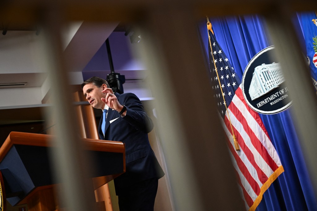 Photo by ALEX WROBLEWSKI / AFP  US Deputy Attorney General Todd Blanche speaks during a press conference at the US Department of justice on January 30, 2026 in Washington, DC.