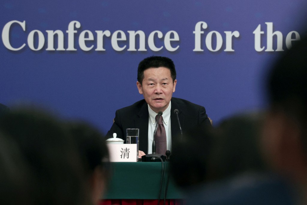 China Securities Regulatory Commission (CSRC) Chairman Wu Qing attends a press conference on the sidelines of the National People's Congress (NPC), in Beijing, China March 6, 2024. REUTERS/Tingshu Wang