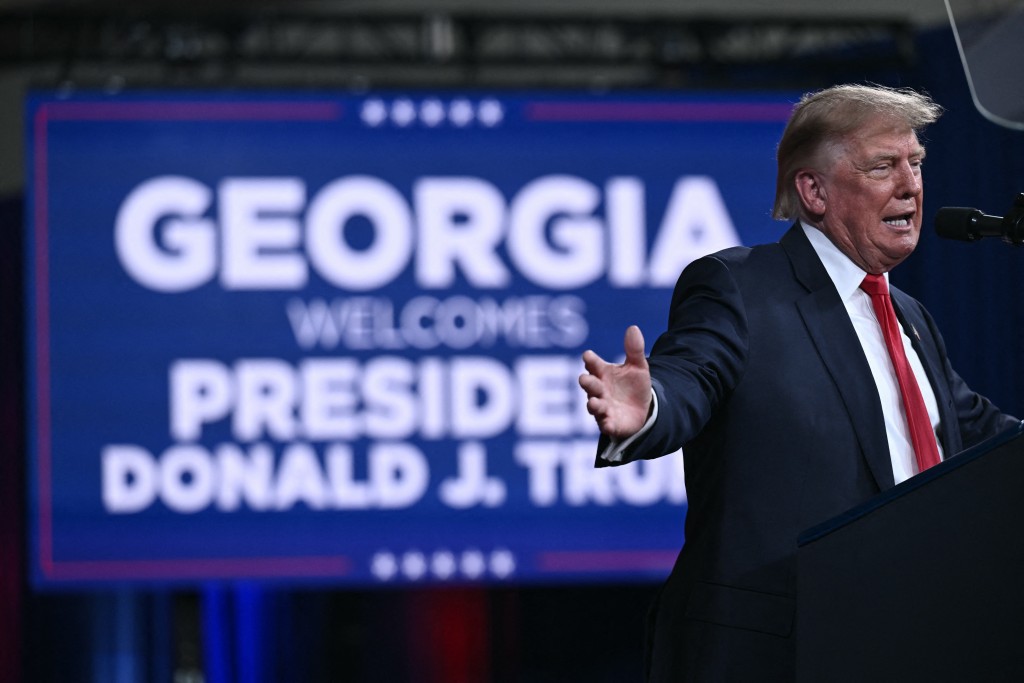 Photo by BRENDAN SMIALOWSKI / AFP  US President Donald Trump speaks at a midterm election campaign rally at Guardian Centers of Georgia in Perry, Georgia on October 24, 2026.