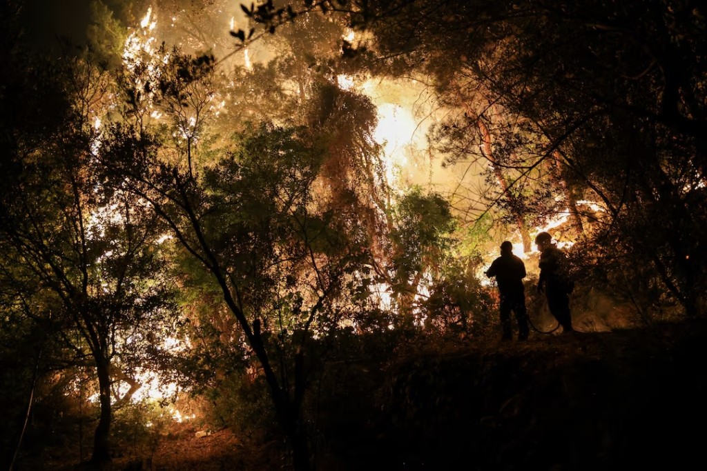 Firefighters try to tackle a wildfire burning on Chios island, Greece, June 23, 2025. (REUTERS/Konstantinos Anagnostou)