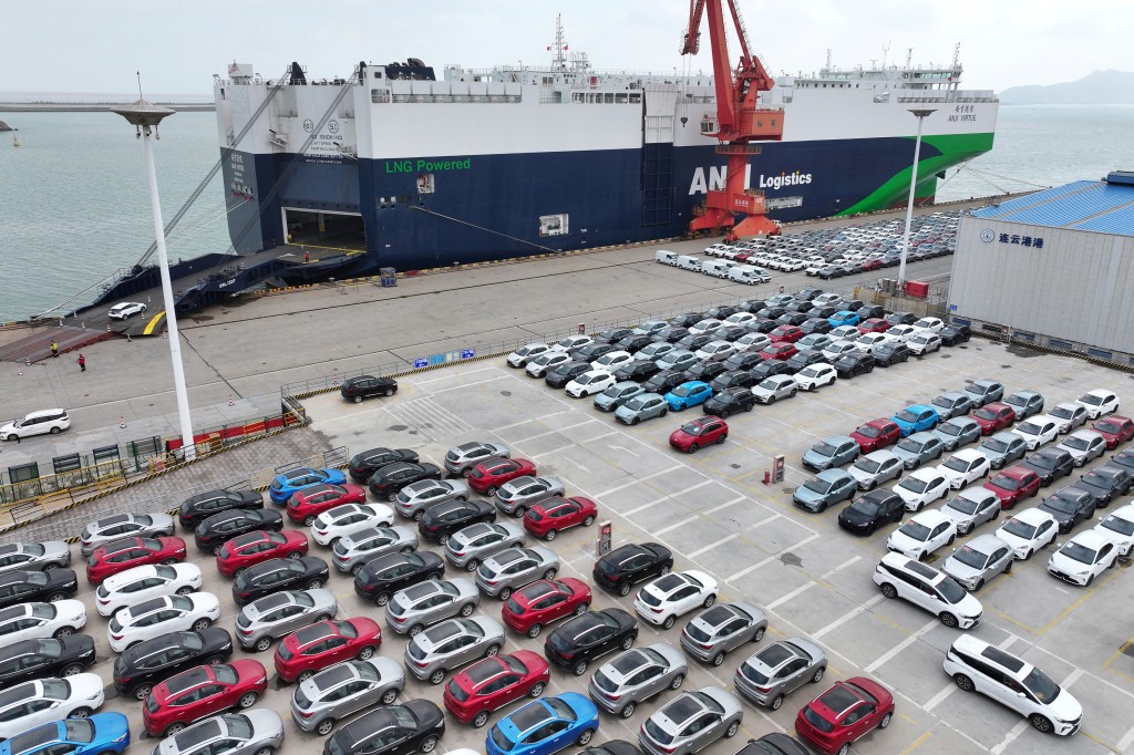 This picture shows cars for export before being loaded at a port in Lianyungang, eastern China's Jiangsu province on February 25, 2026. (Photo by CN-STR / AFP)