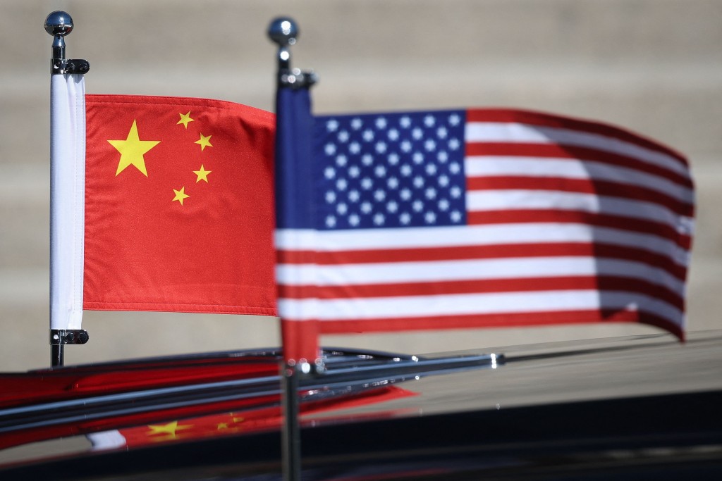 The American and Chinese flags are seen on the motorcade of U.S. President Donald Trump as he visits the National Archives Museum with President of China Xi Jinping on September 25, 2026 in Washington, DC. AFP