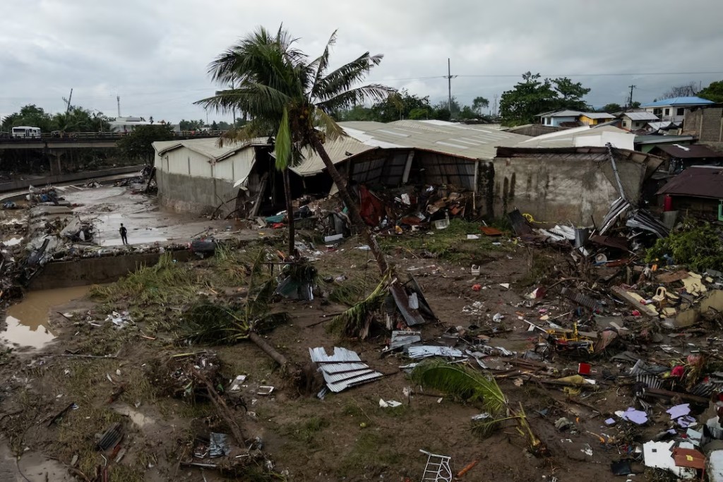 A man stands amid the damage caused by Typhoon Kalmaegi in Talisay, Cebu, Philippines, November 5, 2025. REUTERS/Eloisa Lopez