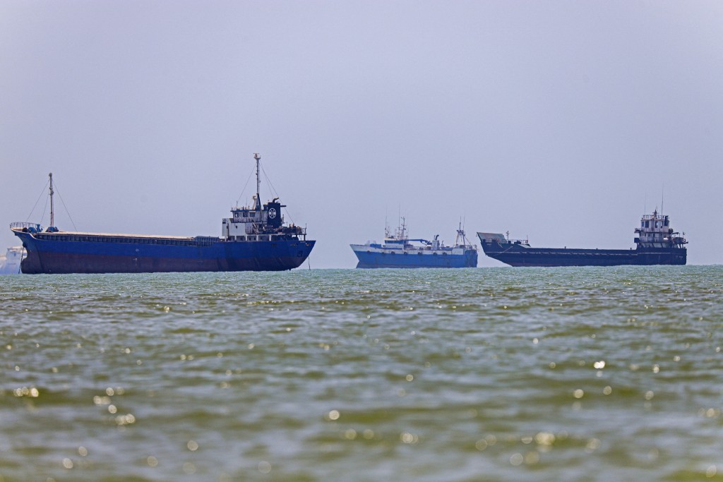 In this picture obtained from Iran's ISNA news agency on June 18, 2026, vessels are seen anchored in Bandar Abbas along the Strait of Hormuz. Tehran announced it was closing the Strait of Hormuz on July 12 and launched missiles and drones at its Gulf neighbours, in retaliation for new US strikes following an attack by Iranian forces on a merchant vessel that was abandoned in flames by its crew.