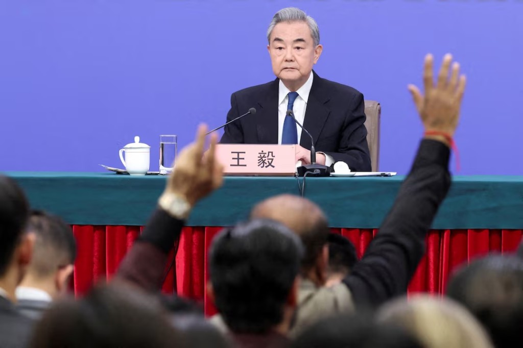 Members of the media raise hands to ask questions as Chinese Foreign Minister Wang Yi holds a press conference on the sidelines of the National People's Congress (NPC), in Beijing, China, March 8, 2026. REUTERS/Maxim Shemetov/File Photo