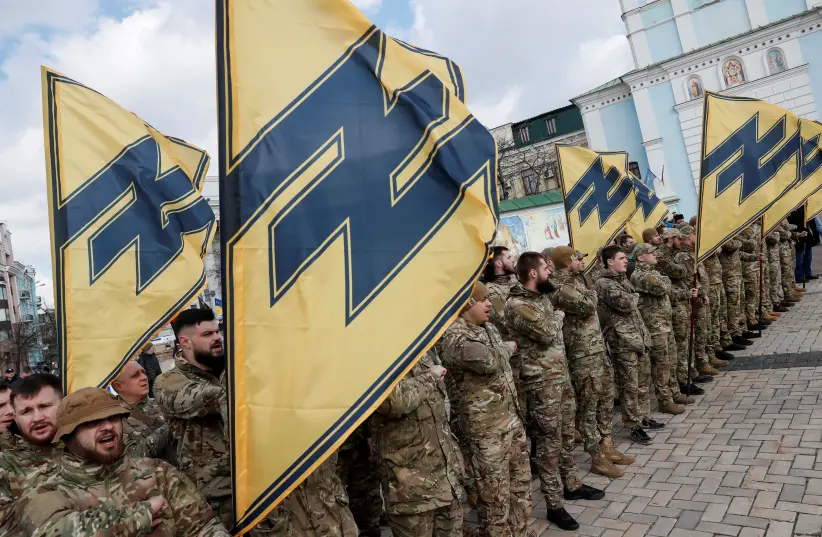 Members of Azov battalion attend a rally on the Volunteer Day honoring fighters, who joined the Ukrainian armed forces during a military conflict in the country's eastern regions, in central Kyiv, Ukraine. (Reuters) Members of Azov battalion attend a rally on the Volunteer Day honoring fighters, who joined the Ukrainian armed forces during a military conflict in the country's eastern regions, in central Kyiv, Ukraine. (Reuters)
