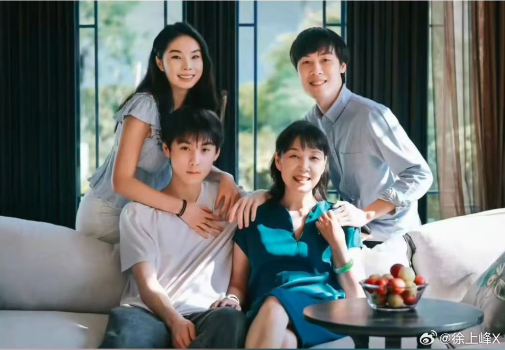 Du Jianying, seated, with her three children, who are the plaintiffs.