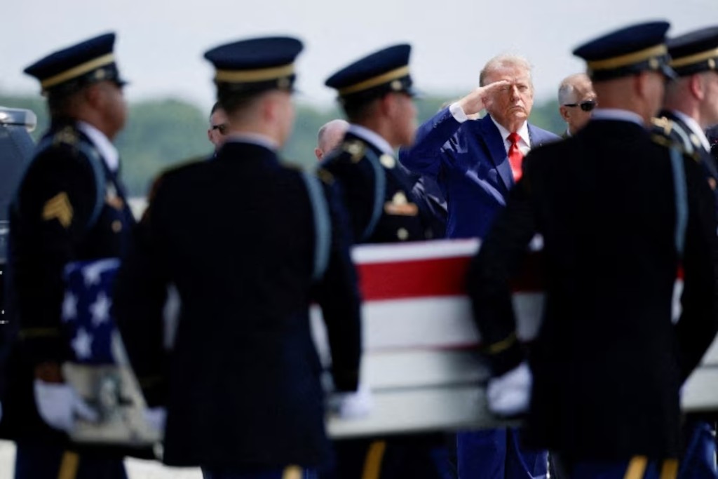 U.S. President Donald Trump salutes as members of the military carry the transfer case of U.S. Army Sgt. Angel S. Rampersad of the 1st Battalion, 57th Air Defense Artillery Regiment, 52nd Air Defense Artillery Brigade, 10th Army Air Missile Defense Command, who was killed during an attack at Muwaffaq Salti Air Base in Jordan, during a dignified transfer of his remains at Dover Air Force Base in Dover, Delaware, U.S., July 22, 2026. REUTERS/Evan Vucci/File Photo