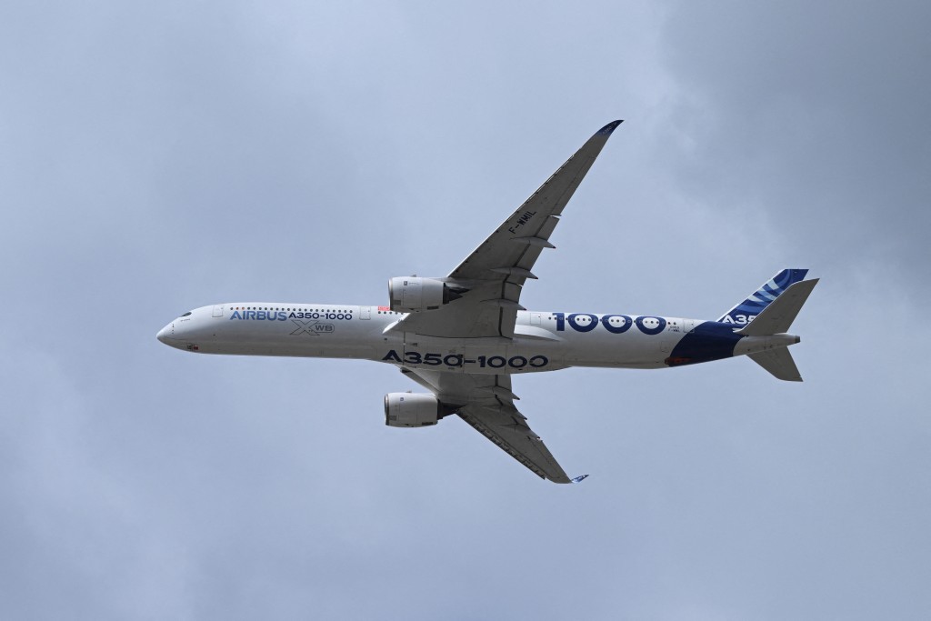 An Airbus A350-1000 flies during the Farnborough Airshow, in Farnborough, Britain, July 21, 2026. REUTERS