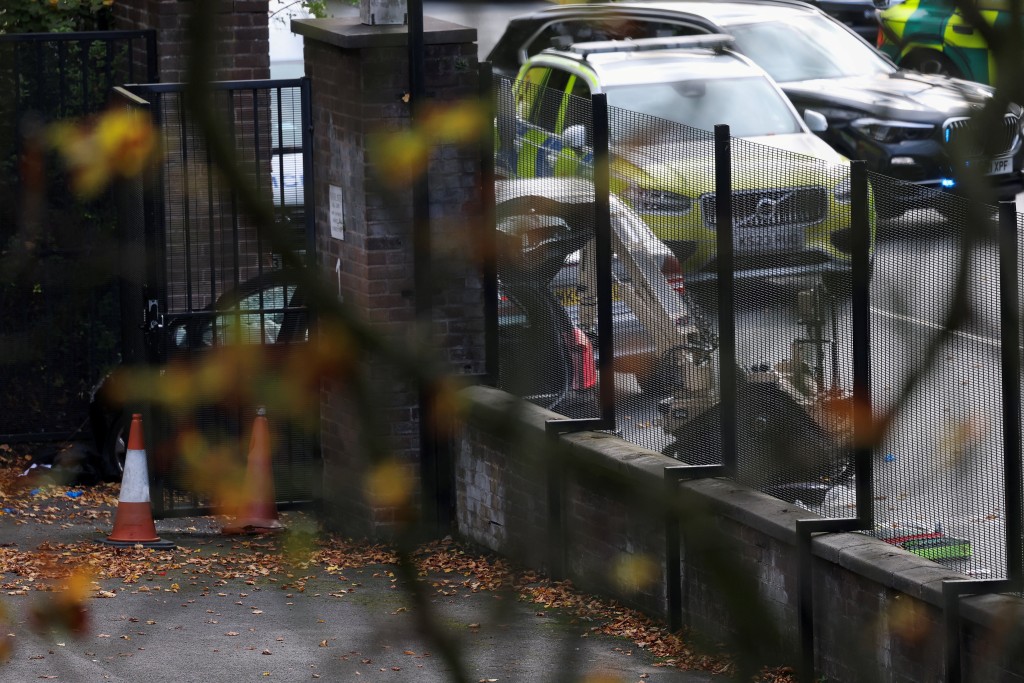 A bomb disposal robot works by a car with a broken windshield, at the scene, after a report of an incident in which a car was driven at pedestrians and a stabbing attack outside a synagogue, in north Manchester, Britain, October 2, 2025. (Reuters)