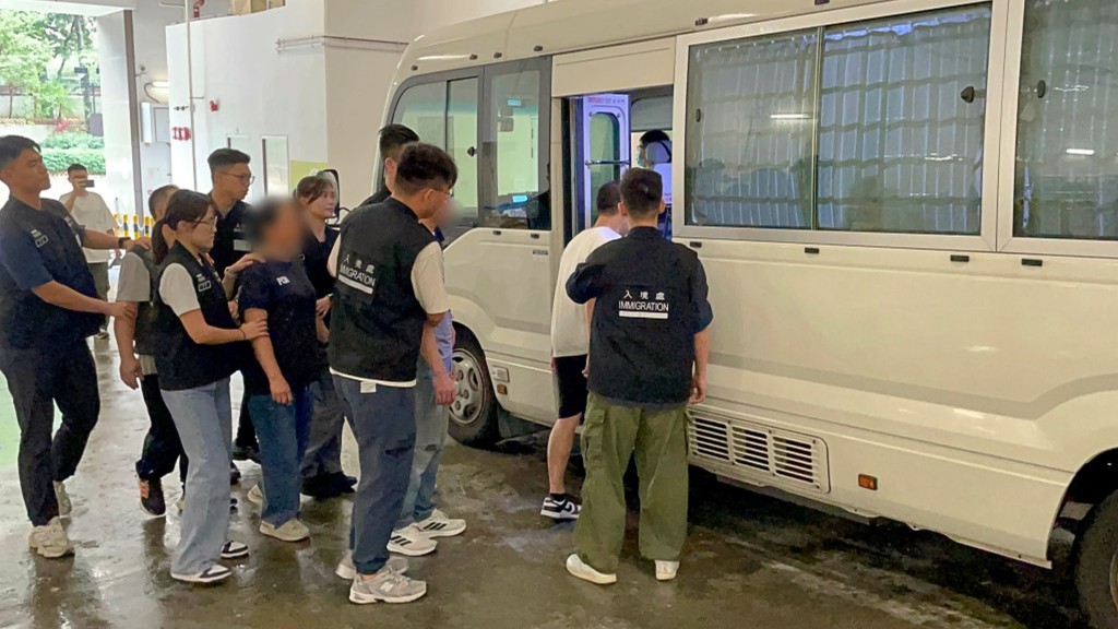 Suspected illegal workers taken away by police in an operation. (Photo: File)